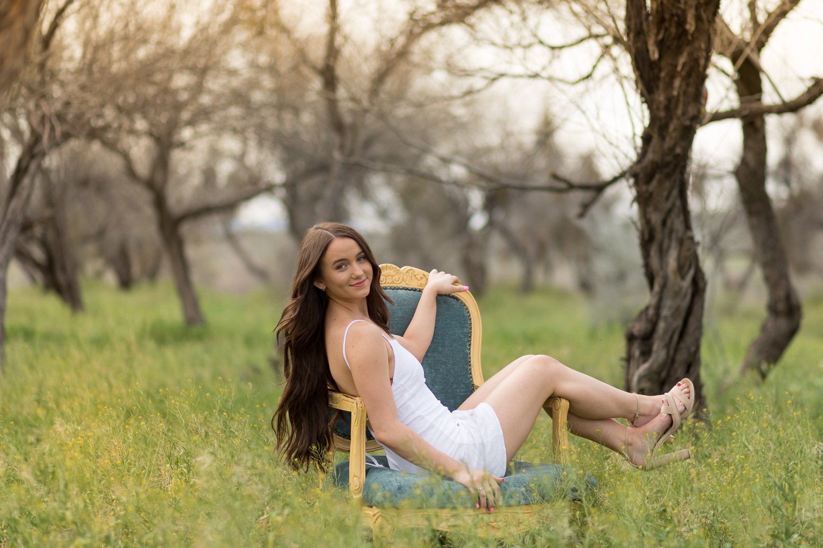 Senior portrait outdoors in a grove of trees